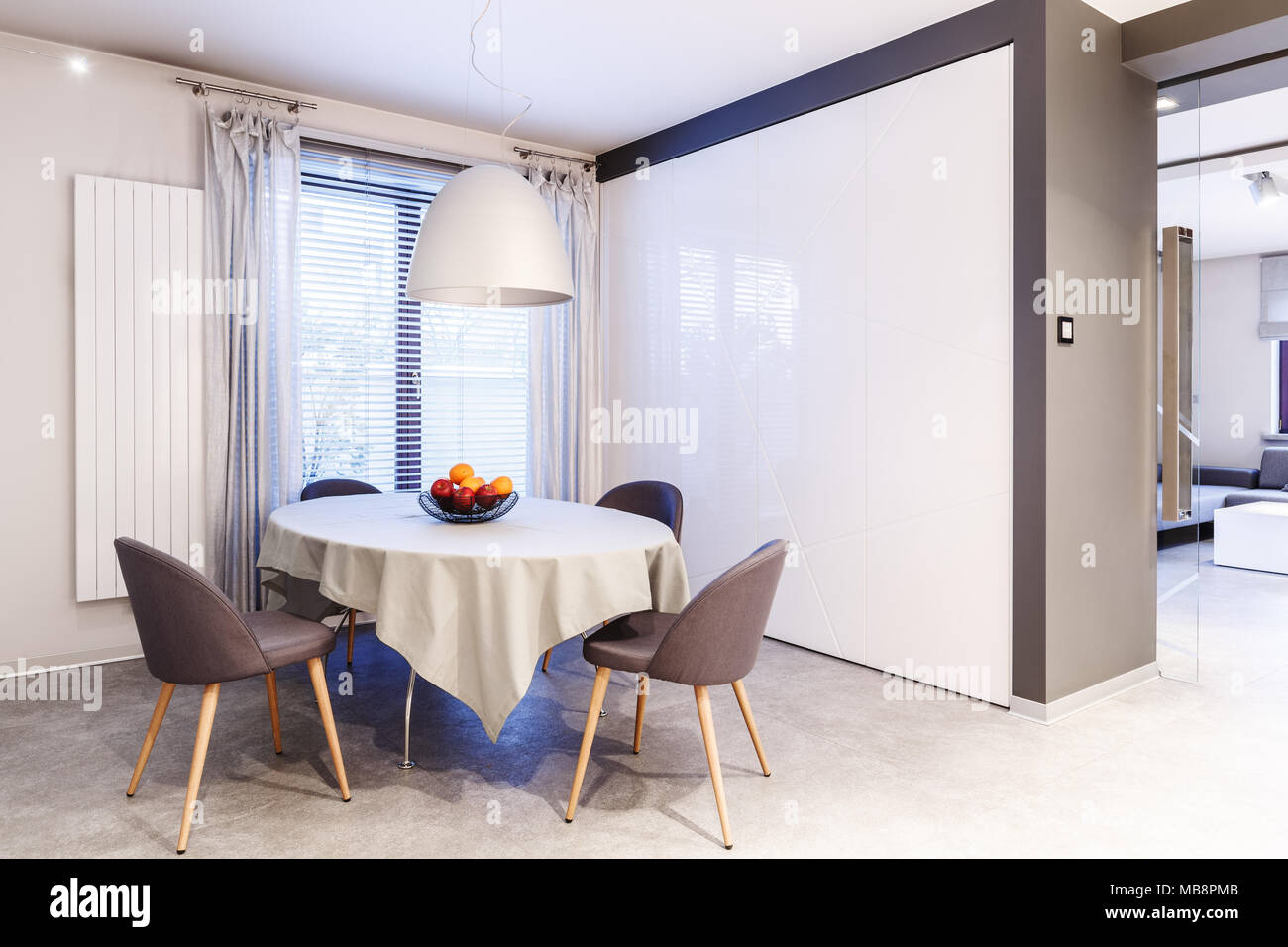 Simple Spacious White And Brown Dining Room Interior