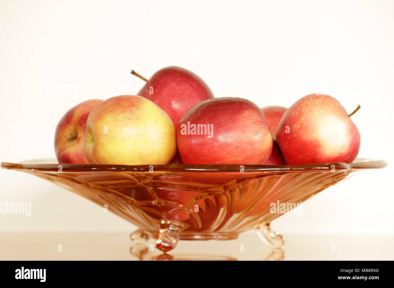 Glass bowl with apples Stock Photo Alamy