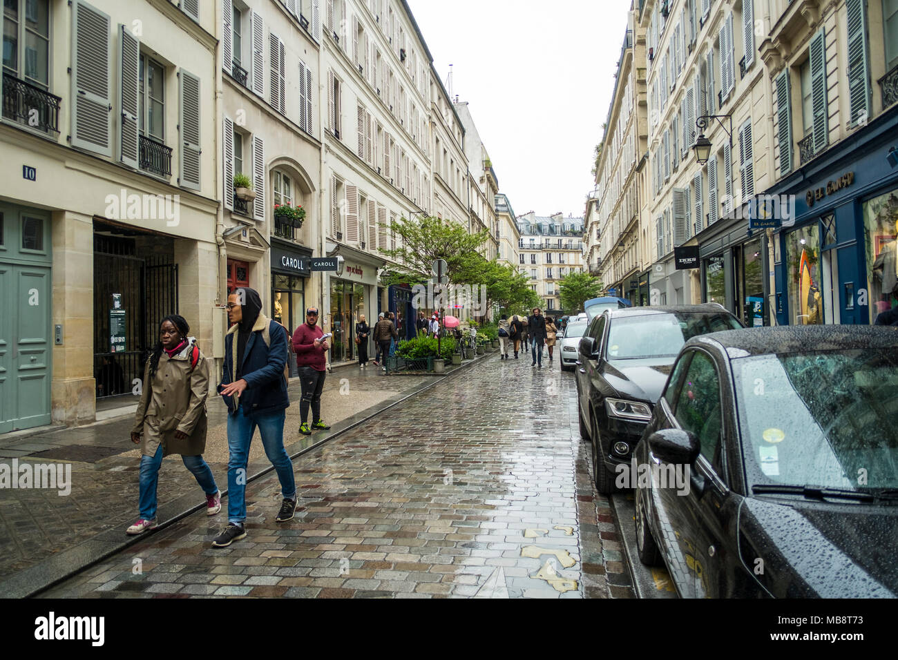 Walking in the streets of Paris in May. The light drizzle couldn'tt spoil the mood... Stock Photo