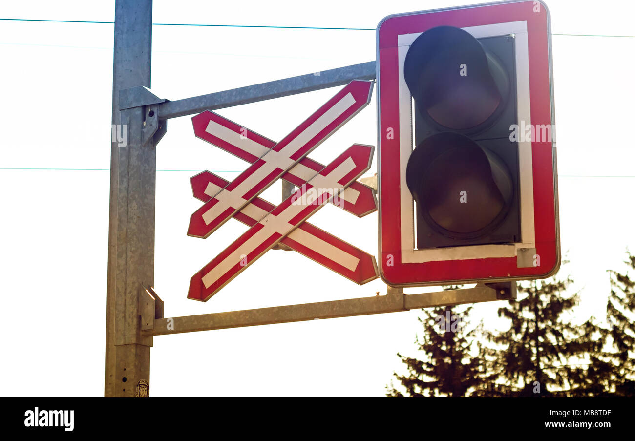 Close up of train level crossing light and sign Stock Photo