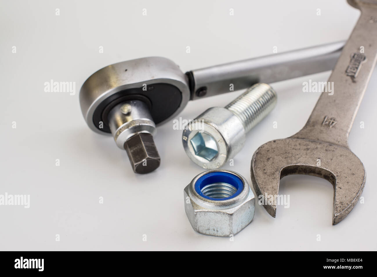 Torque wrench, spanners and nuts on white background Stock Photo