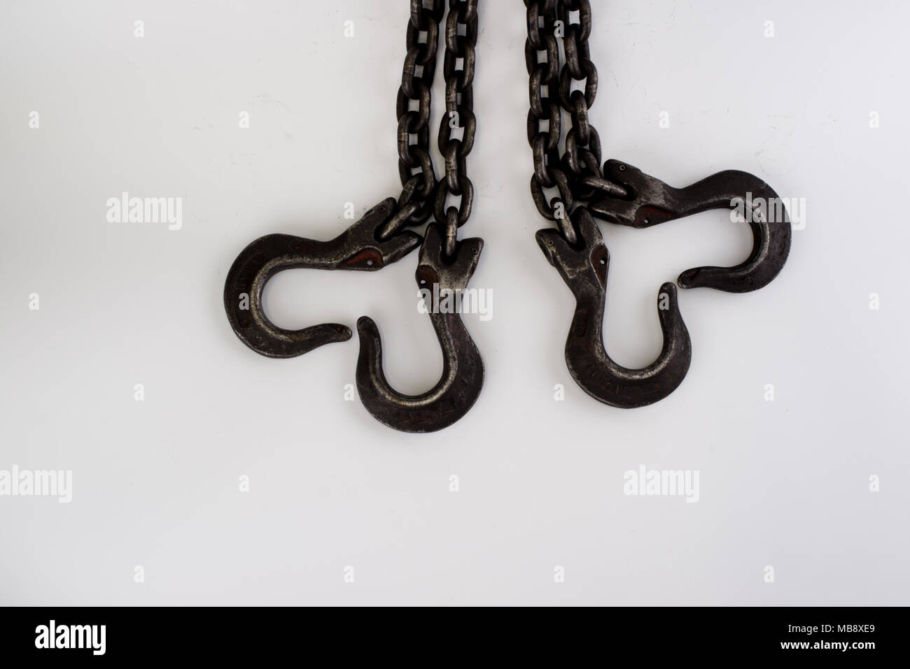 The old steel chains in form of heart on a white background Stock Photo