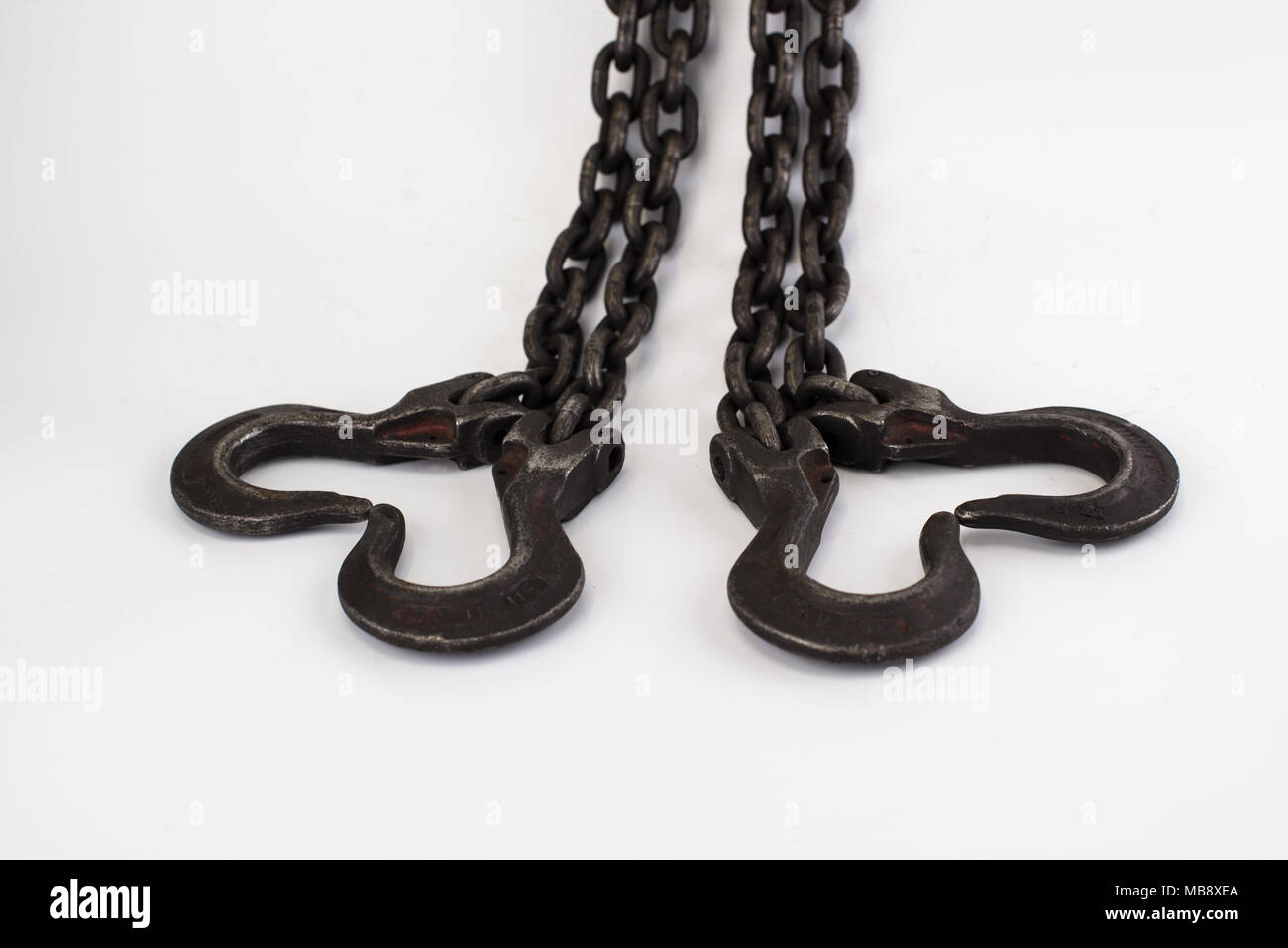 The old steel chains in form of heart on a white background Stock Photo