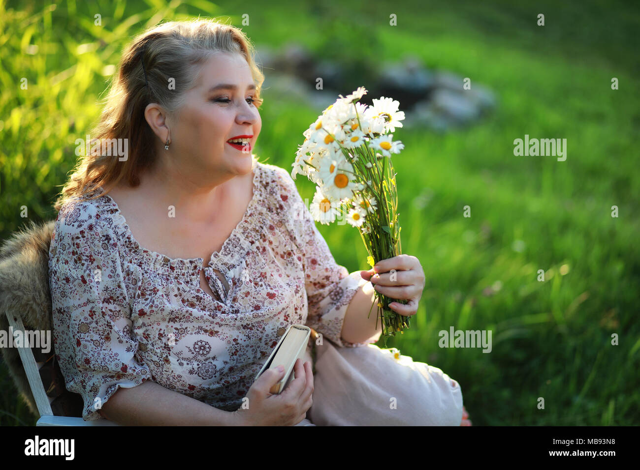 An elderly woman on the porch of a house Stock Photo - Alamy
