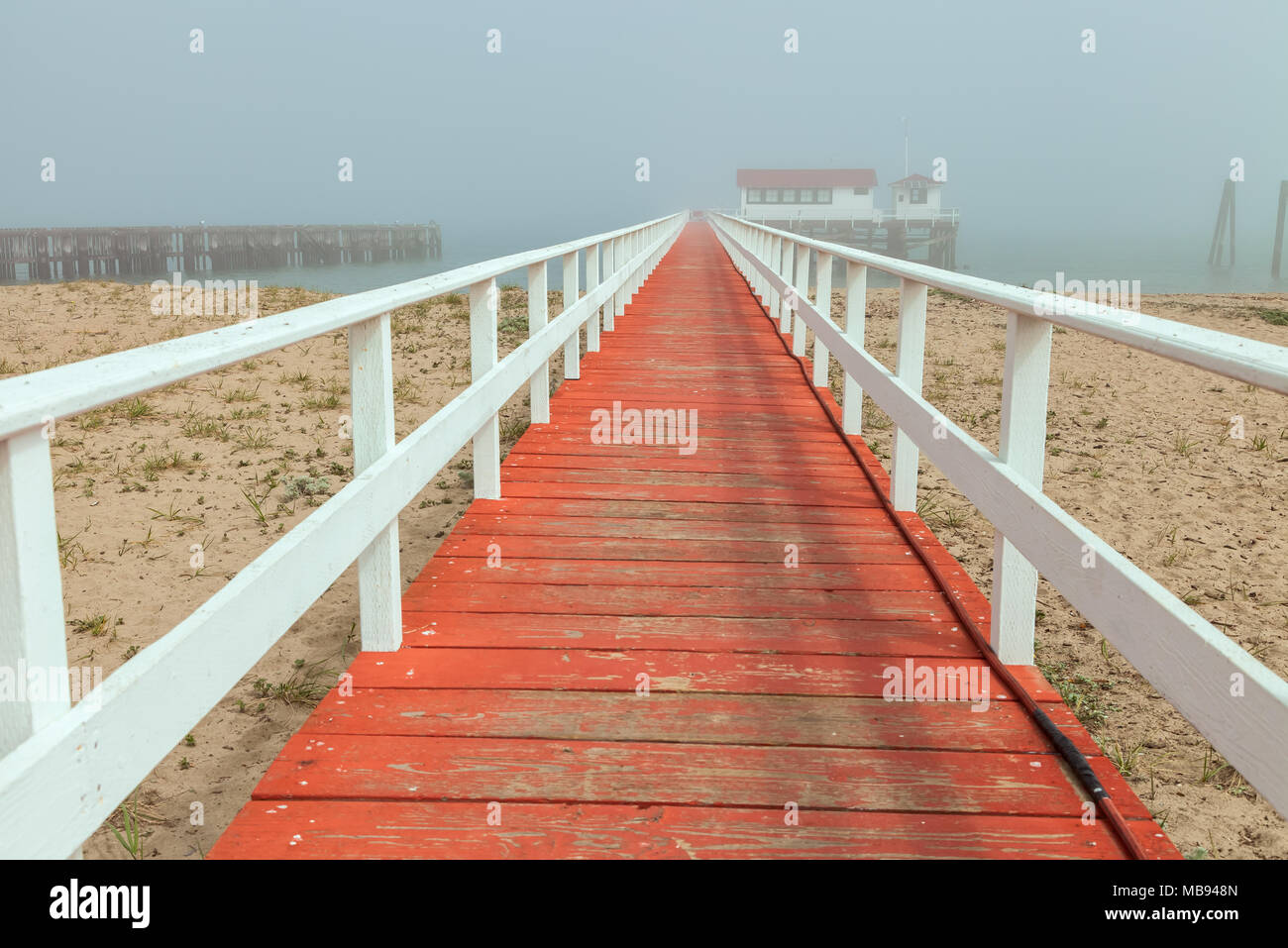 The red -painted deck which lead into the the Greater Farallones National Marine Sanctuary Facility in Crissy Field Beach, San Francisco, California Stock Photo