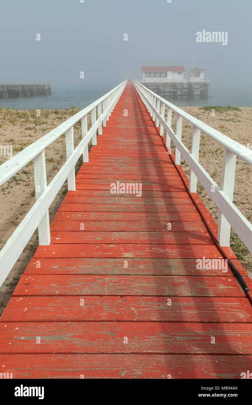 The red -painted deck which lead into the the Greater Farallones National Marine Sanctuary Facility in Crissy Field Beach, San Francisco, California Stock Photo