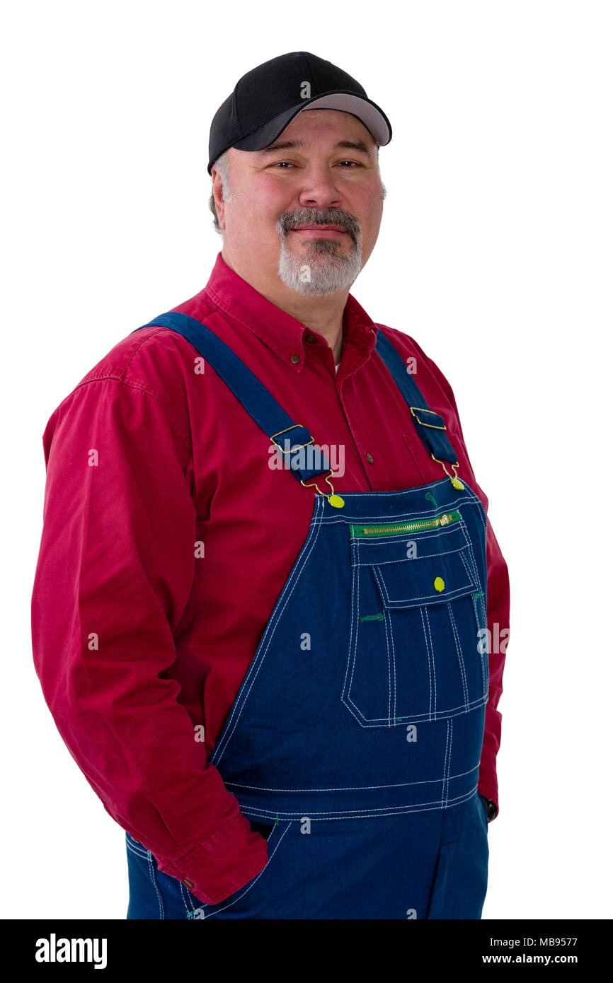 Portrait of cheerful man wearing dungarees standing against white background Stock Photo