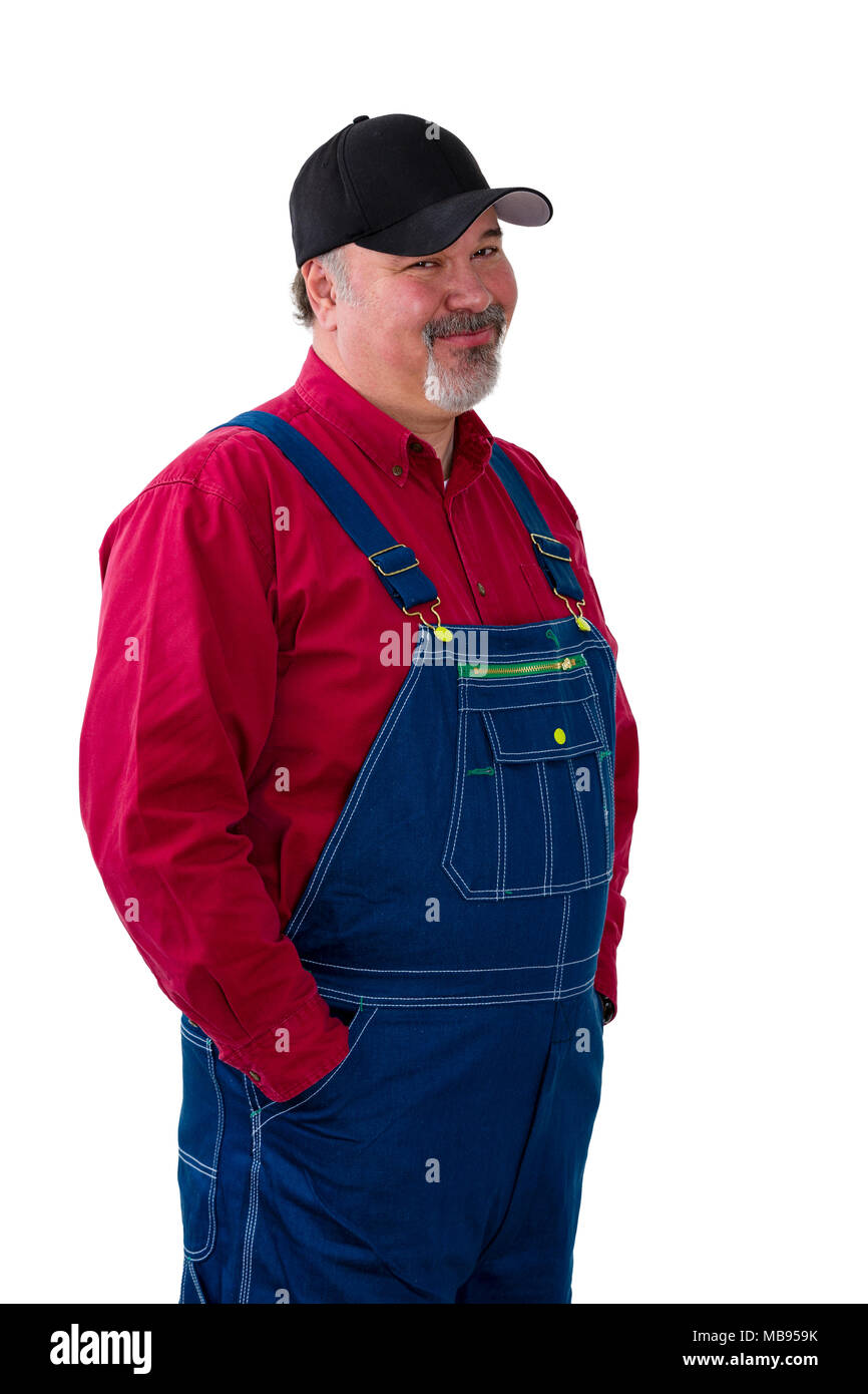 Sceptical farmer or worker standing with hands in the pockets of his
