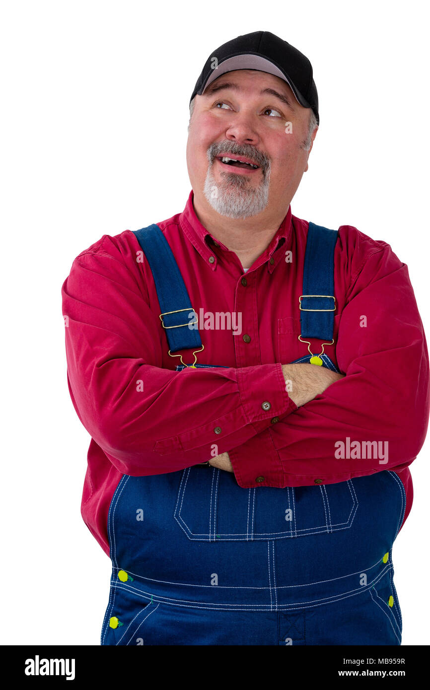 Farmer or worker in dungarees looking up to the side with his mouth open as though speaking isolated on white Stock Photo