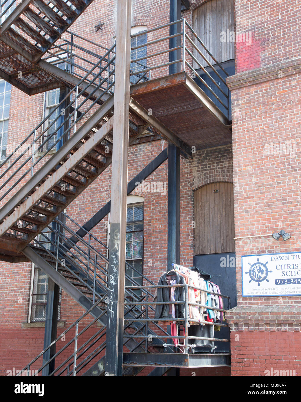 Fire escape stairs on the outside of a building in Patterson, NJ Stock Photo