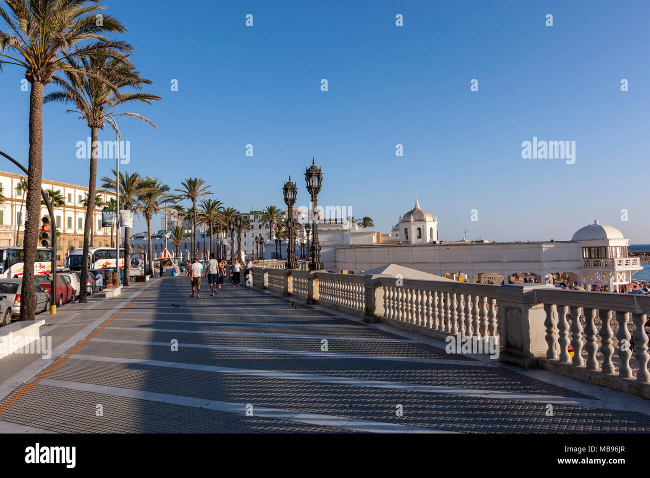 People Walking Along A Promenade Near Playa La Caleta Cadiz