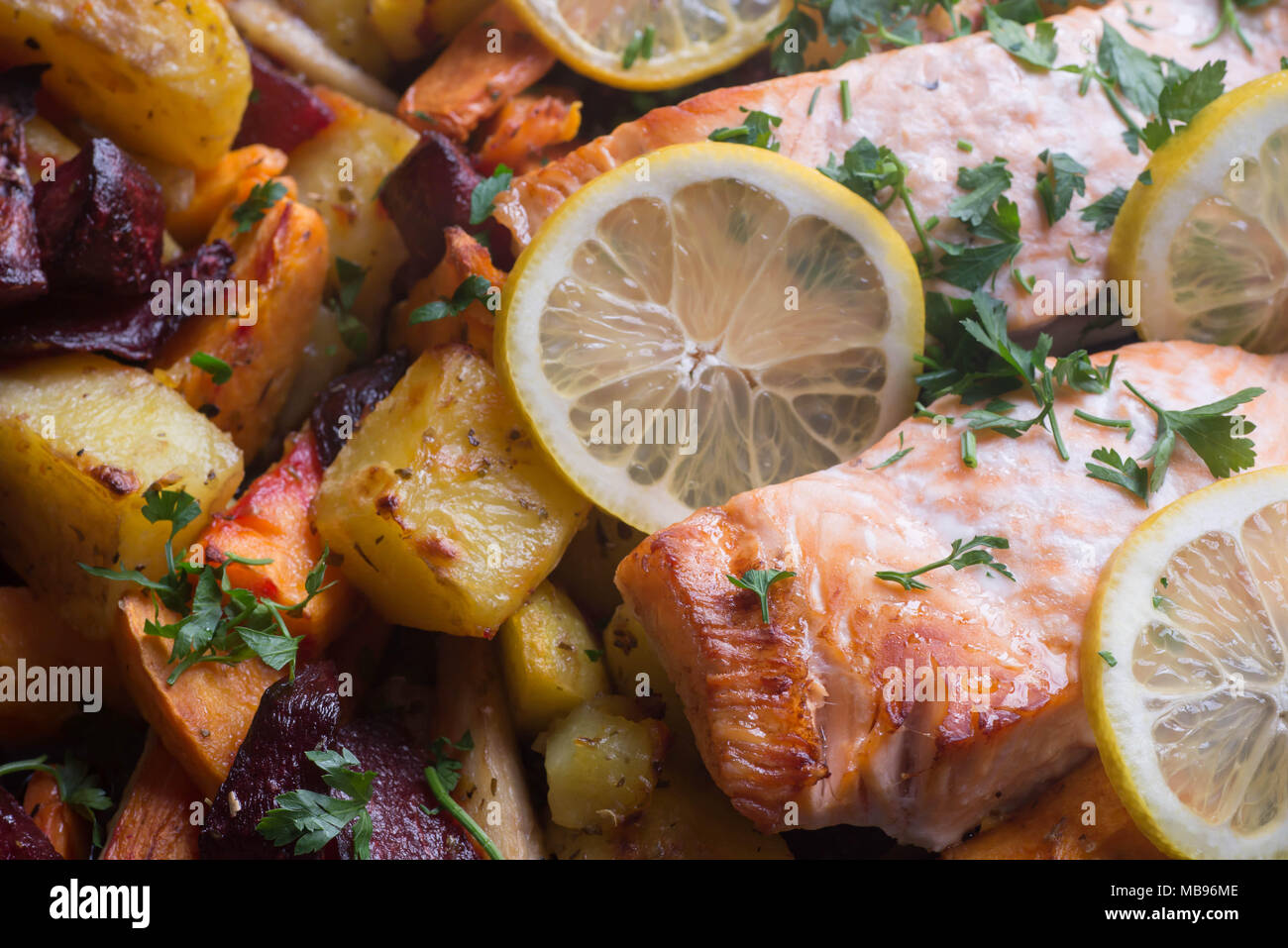 salmon baked with vegetables in oven macro Stock Photo Alamy