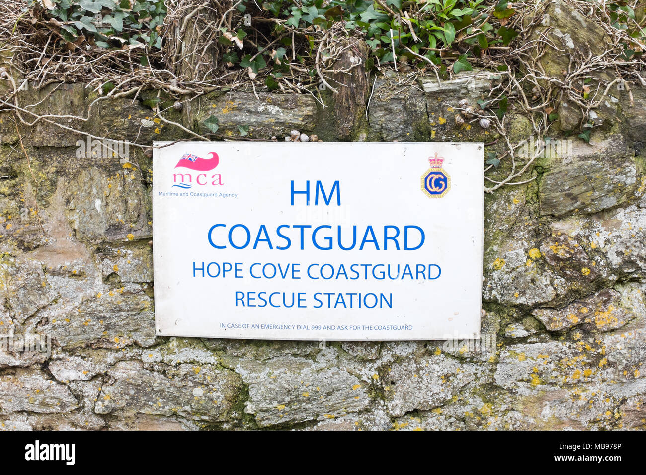 Sign for HM Coastguard at Hope Cove Coastguard Rescue Station in the South Hams, Devon, UK Stock Photo
