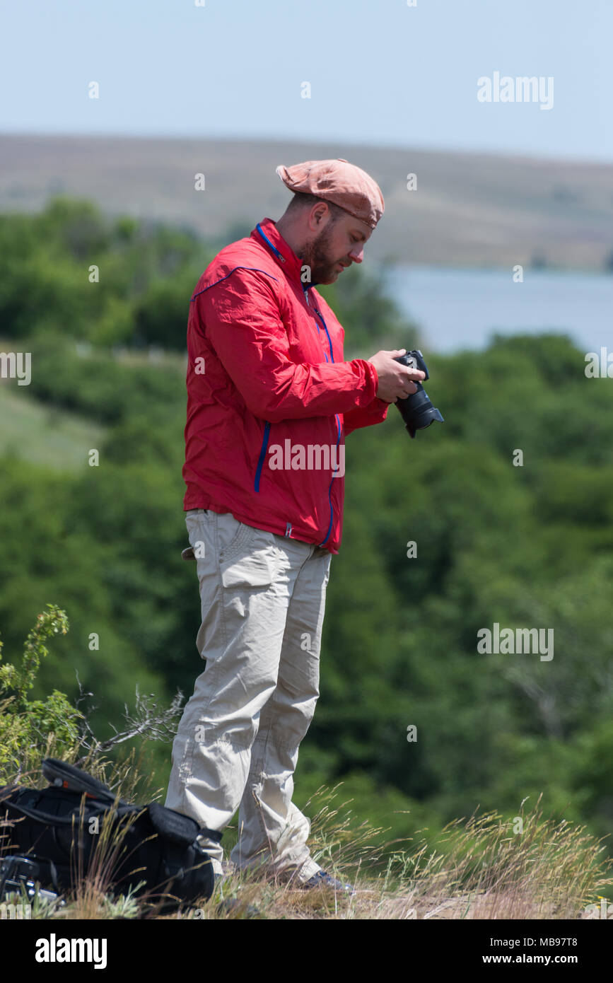 Male photographer at work Stock Photo