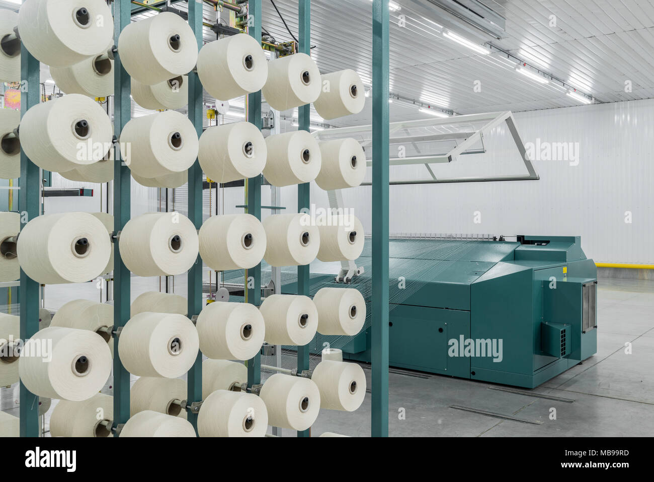 textile yarn on the warping machine. machinery and equipment in a