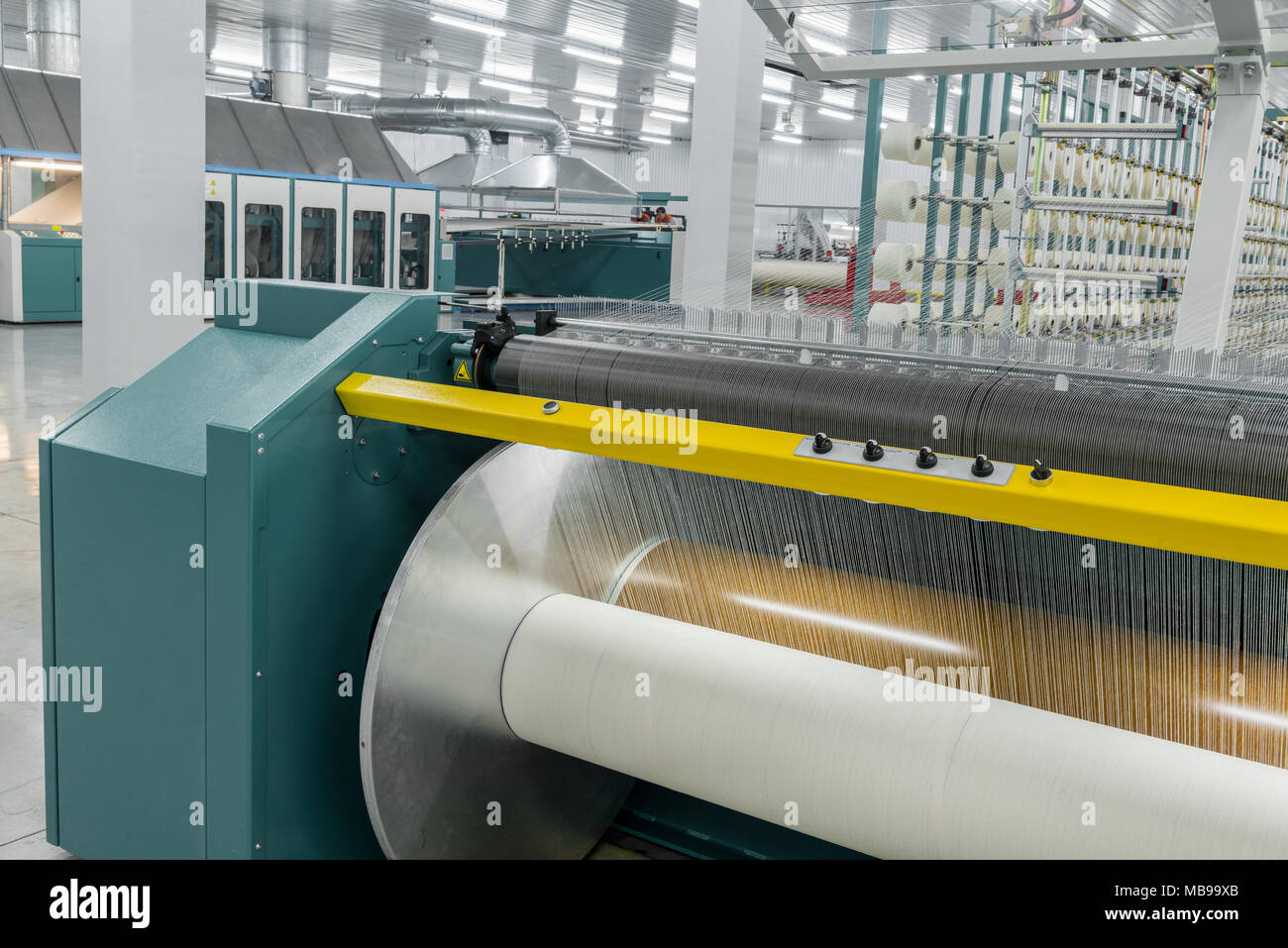 textile yarn on the wrapping machine is screwed on the big shaft