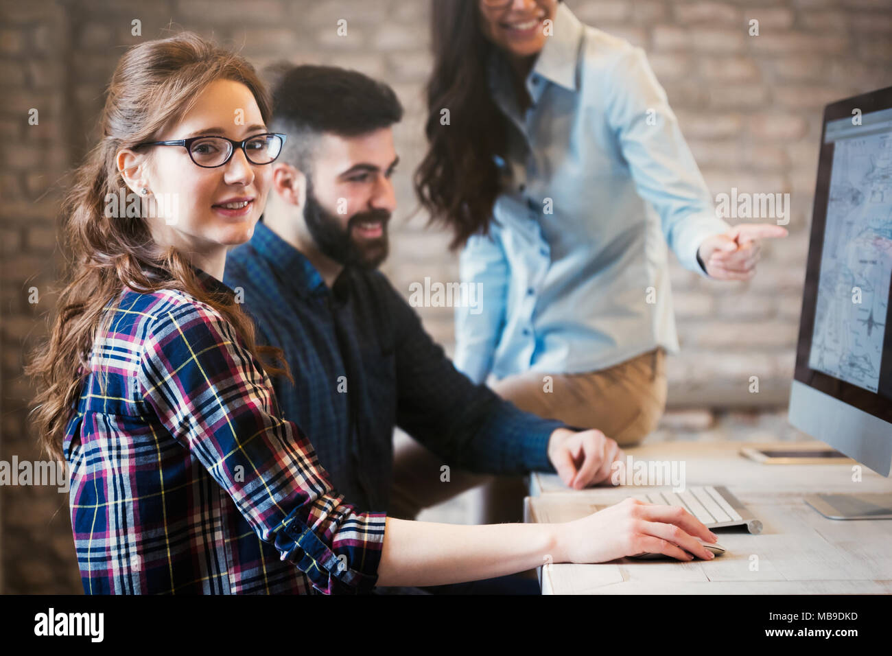 Young architects working on project in office Stock Photo