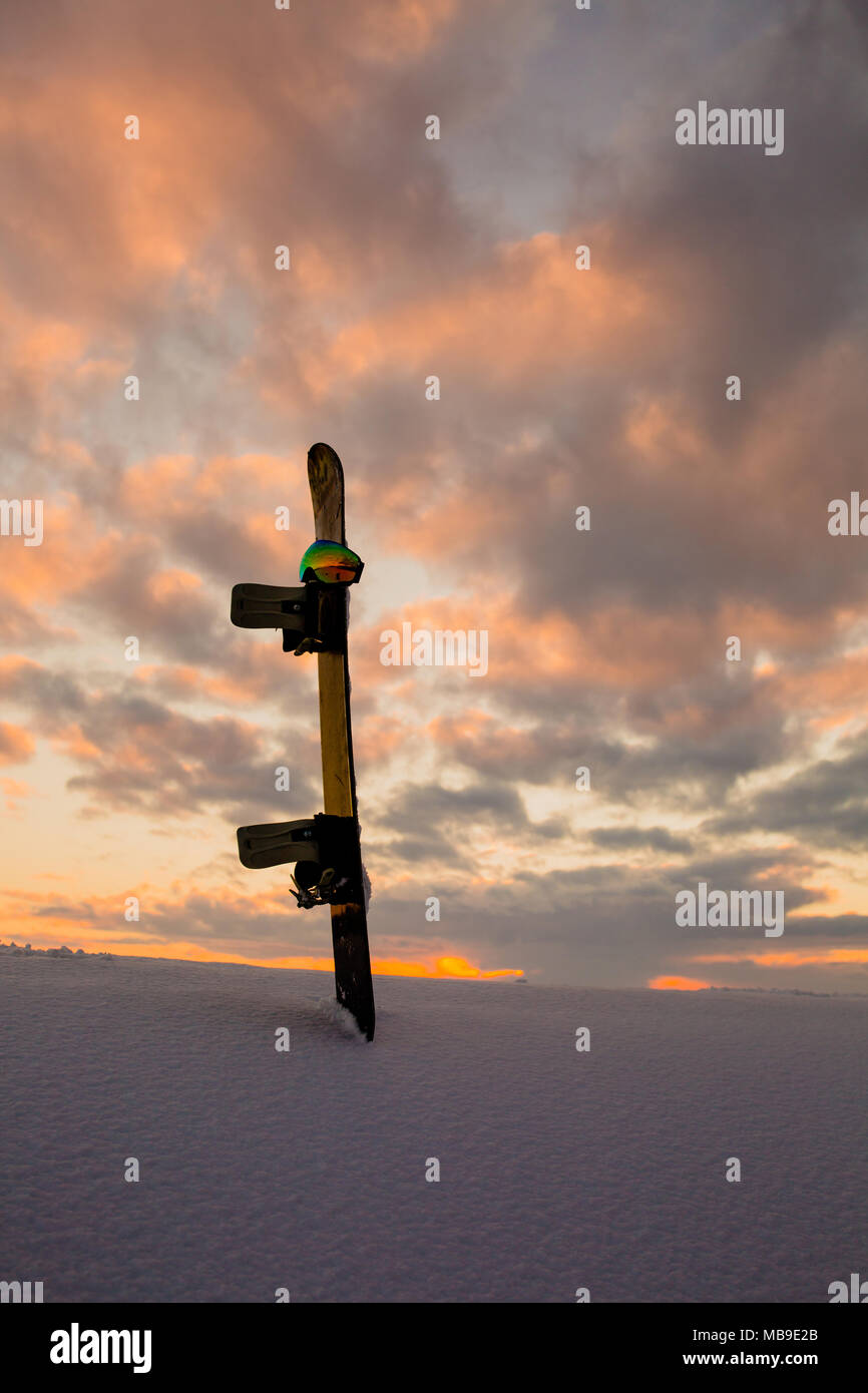 Powder texture and snowboard at sunset Stock Photo Alamy
