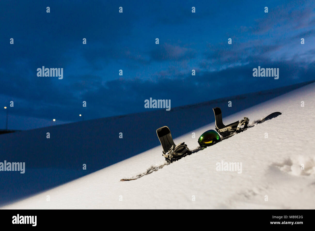 Powder texture and snowboard at sunset Stock Photo Alamy