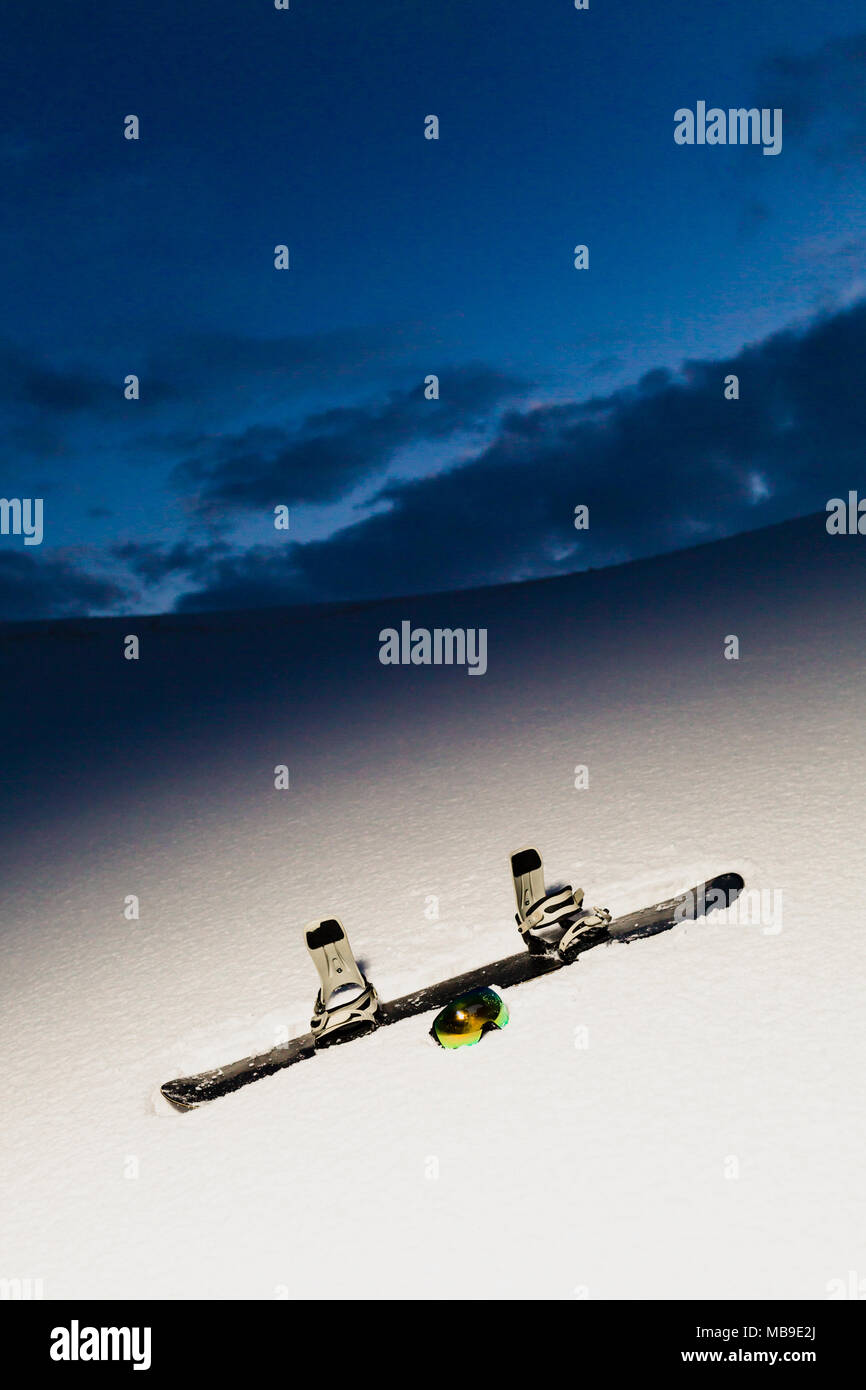 Powder texture and snowboard at sunset Stock Photo Alamy