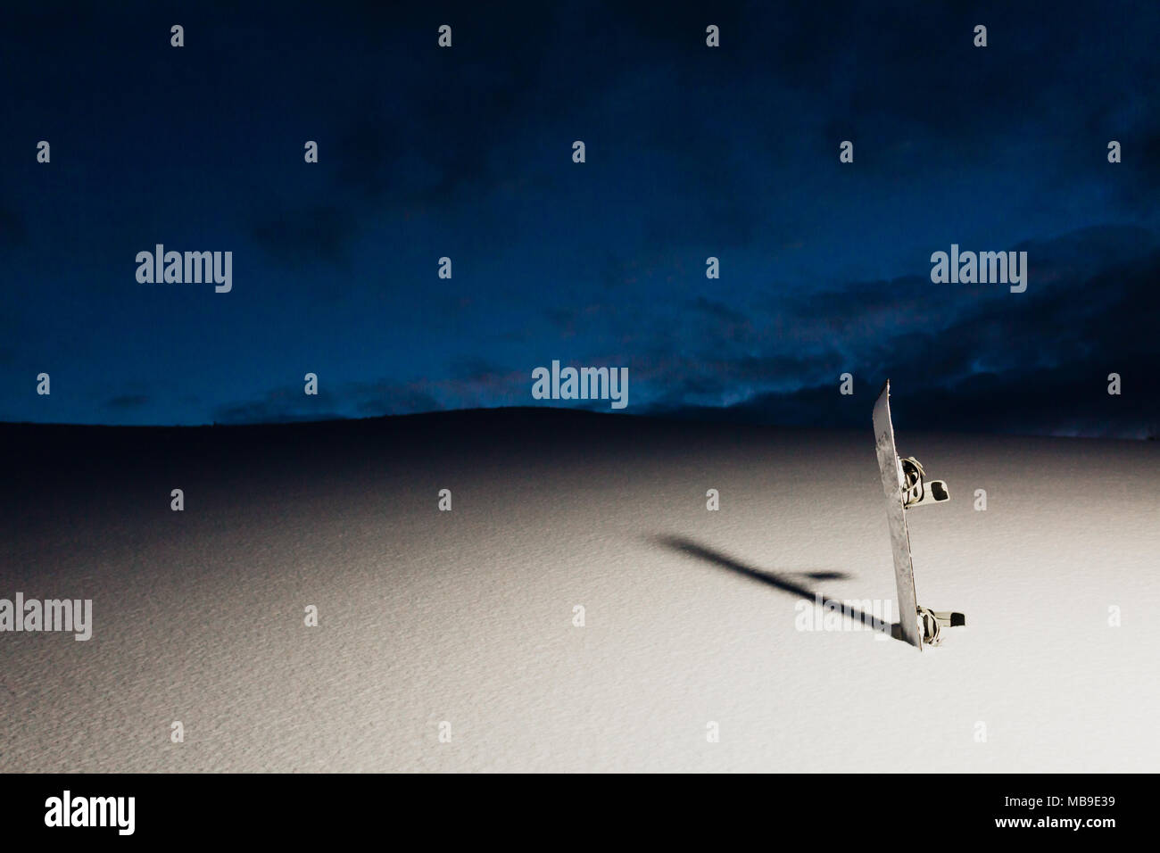 Powder texture and snowboard at sunset Stock Photo Alamy