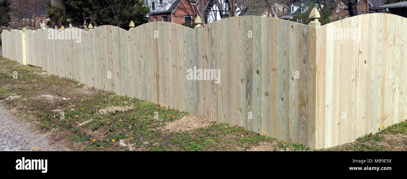 Completed new backyard fence construction. Stock Photo