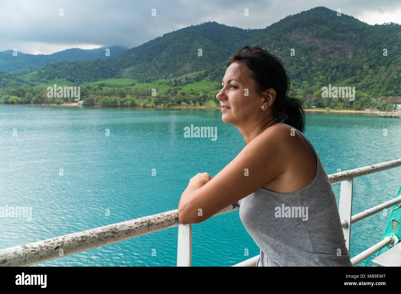 Tourist woman looking at sea view from boat Stock Photo - Alamy