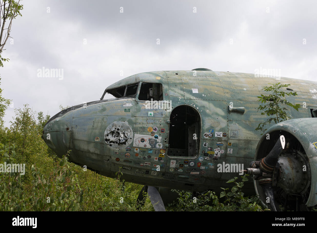 Knocked down Douglas C-47b Dakota at abandoned military airfield Zeljava  of the former Yugoslavian air force in Croatia Stock Photo