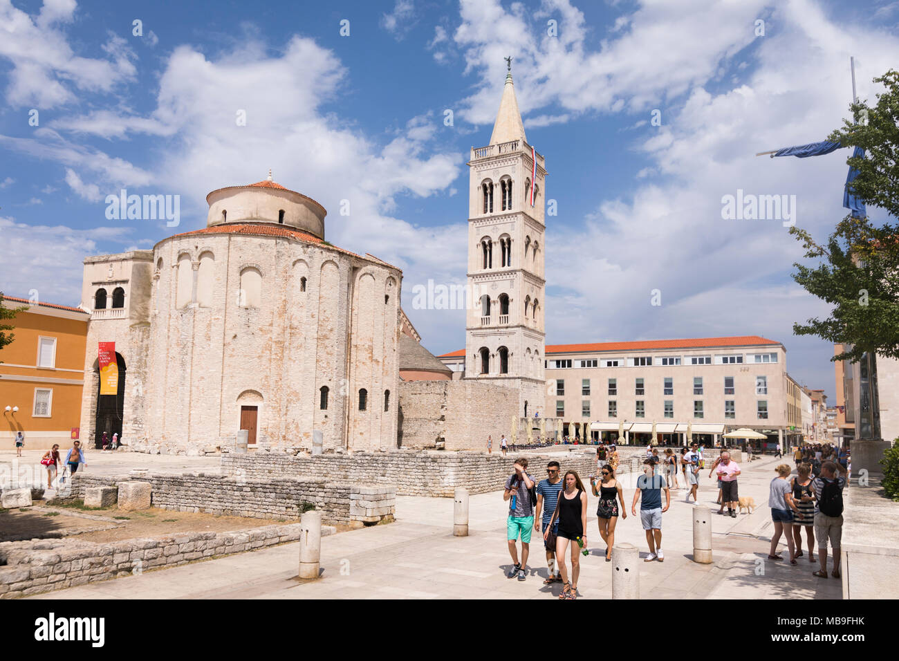 People walking at ancient archaeological Roman finds in front of the St. Donatus church at Zadar, Croatia Stock Photo