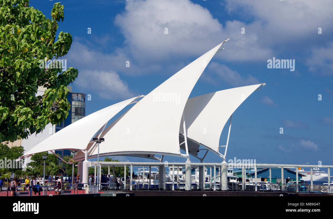 Sails provide shade at terminal for boat trips Male Maldives Stock Photo