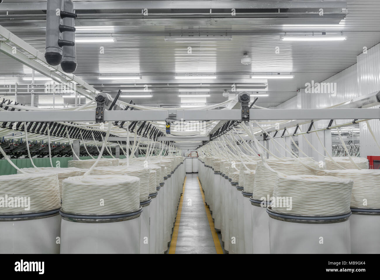 Machinery and equipment in the workshop for the production of thread, overview. interior of industrial textile factory Stock Photo