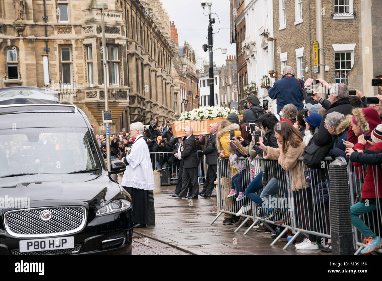 Dr Cally Hammond leads The coffin bearing Stephen Hawking's away from Great St Mary's church Stock Photo