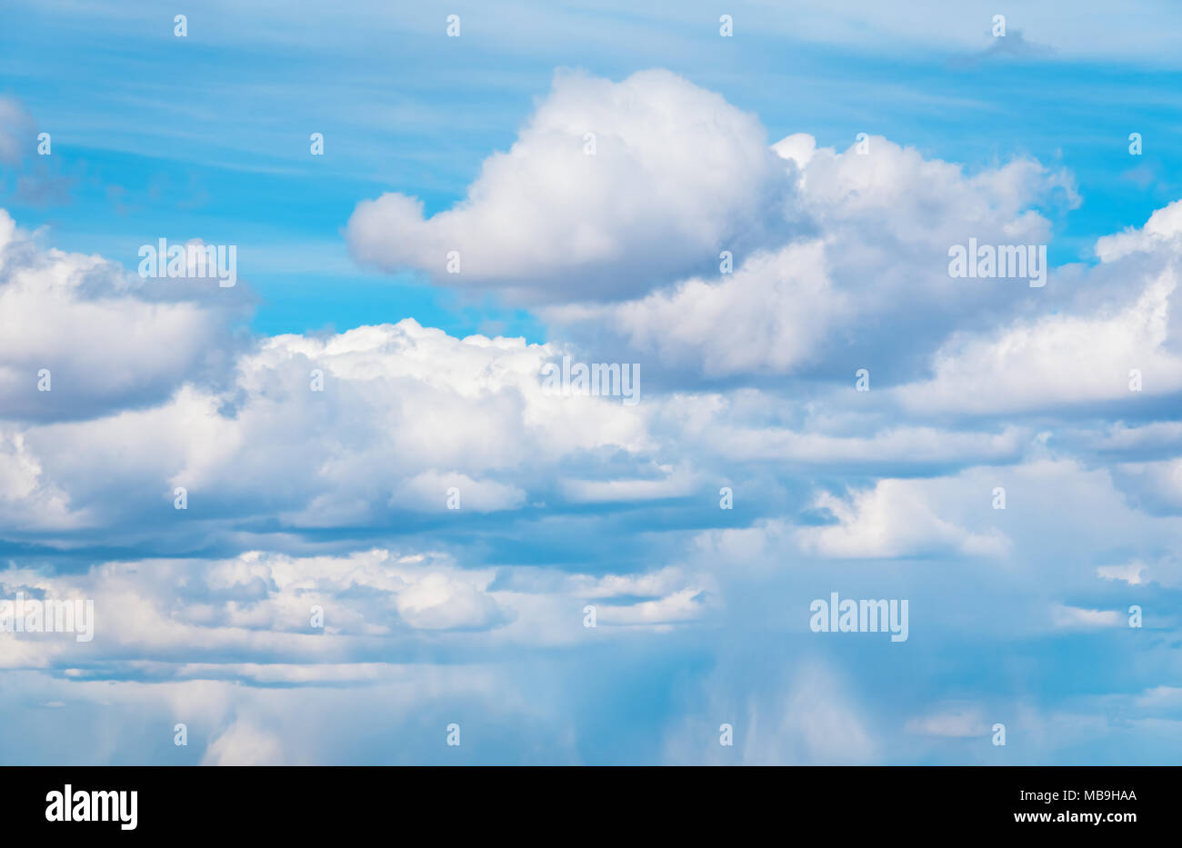 Stormy blue sky background with fluffy huge clouds Stock Photo - Alamy