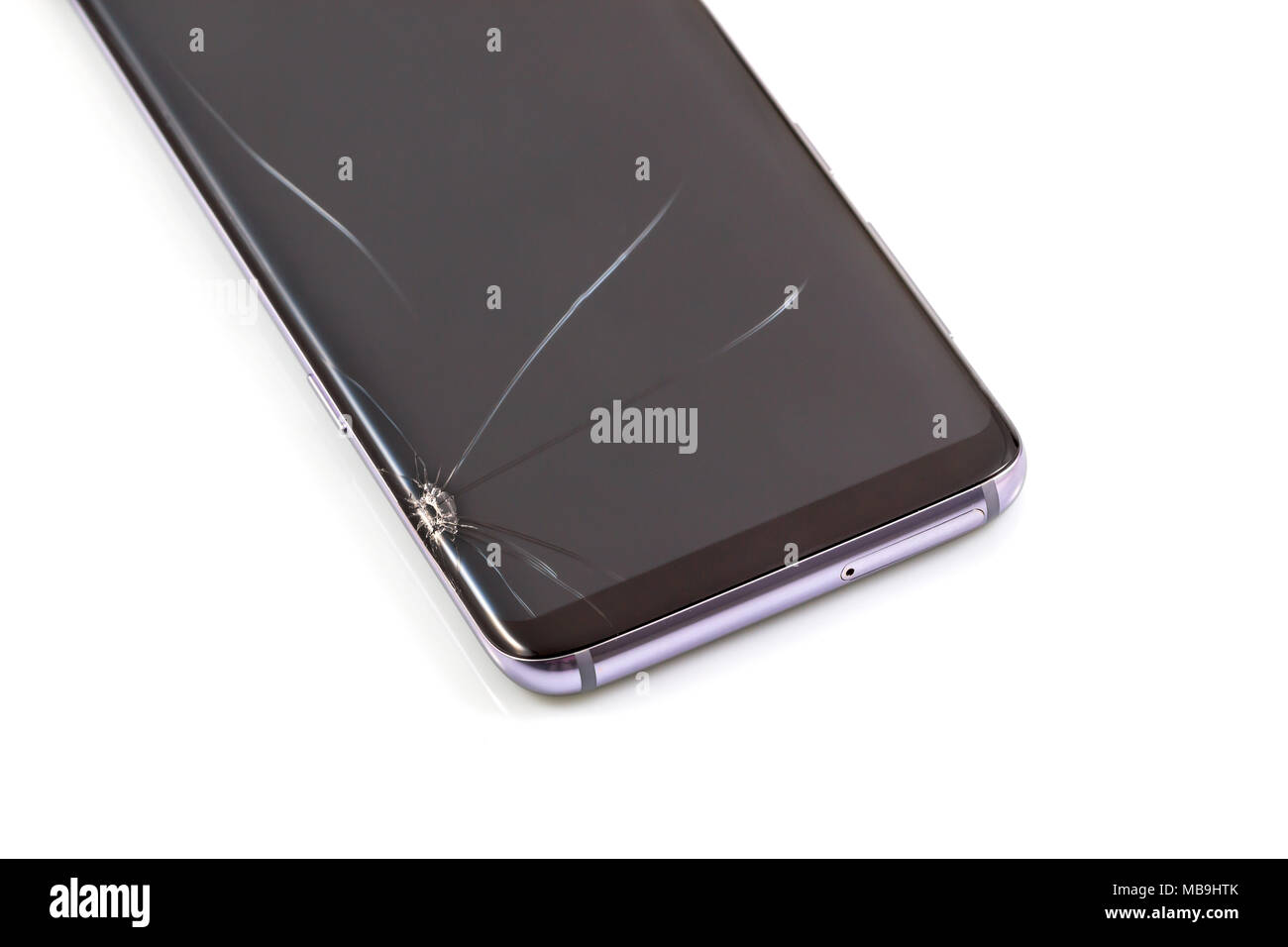 New and modern smartphone with screen has cracks, Touch screen smartphone with broken screen isolated on white background, with clipping path. Stock Photo