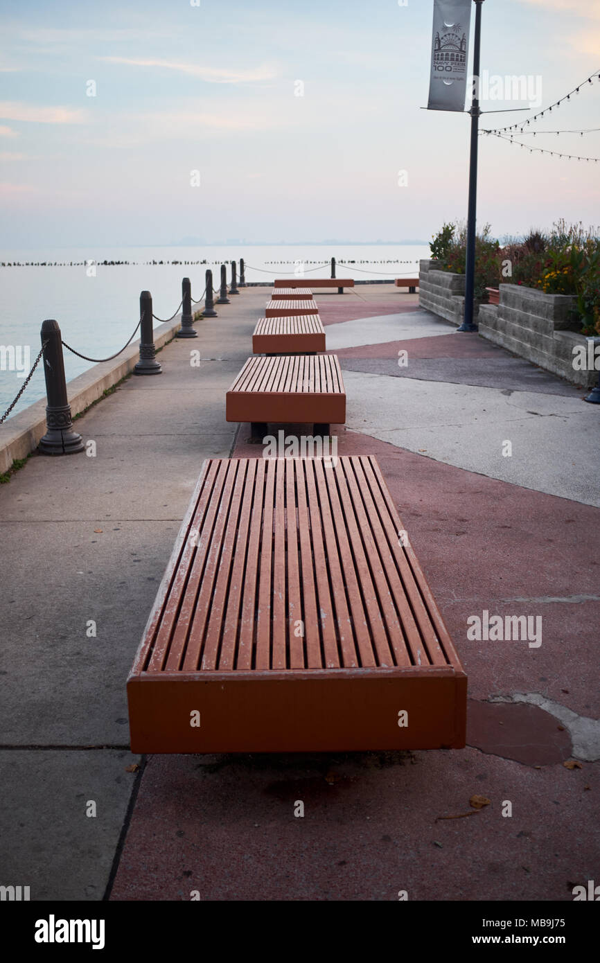 Row of empty benches on the Navy Pier, Chicago, Illinois receding along