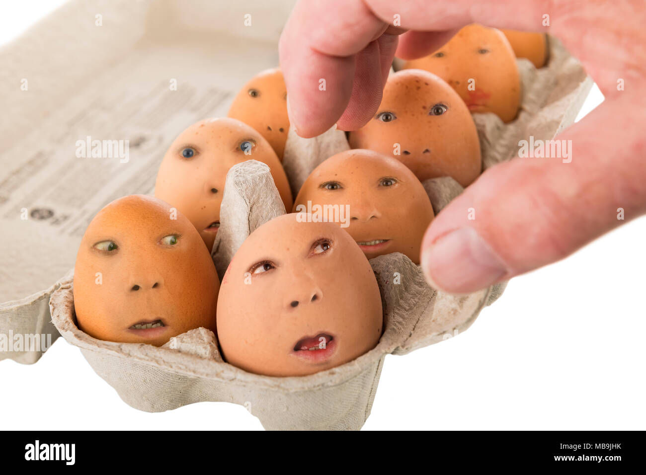 box of eggs with faces Stock Photo