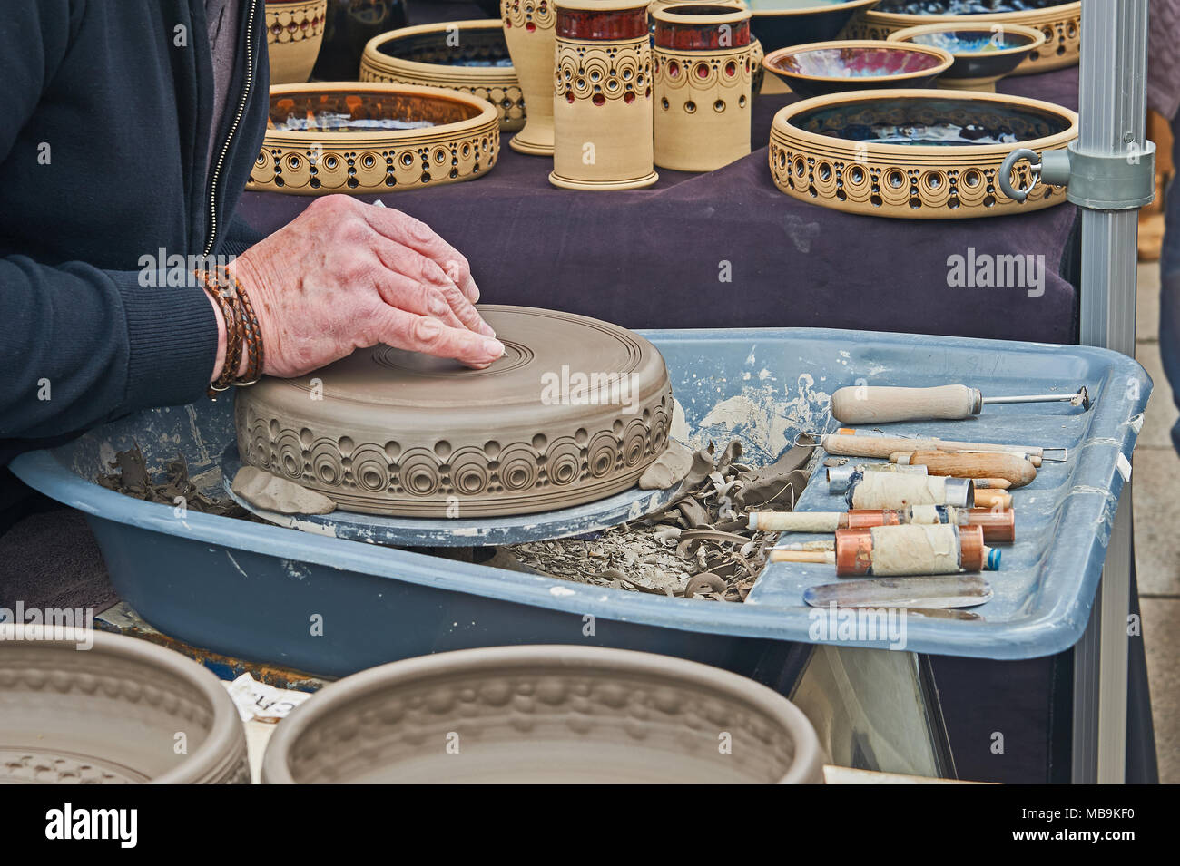 Potter producing ornate bowls at a craft market in Stratford upon Avon Stock Photo