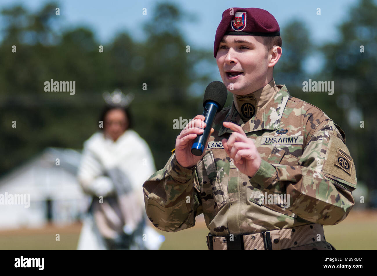 Pinehurst, North Carolina, USA. 8th Apr, 2018. April 8, 2018 - Pinehurst, N.C., USA - A soldier with the 82nd Airborne Division All American Chorus address race patrons at the 69th annual Spring Matinee Harness races sponsored by the Pinehurst Driving & Training Club, at the Pinehurst Harness Track, Pinehurst, N.C. The Pinehurst Harness Track is a 111-acre equestrian facility that has been a winter training center for standardbred horses since 1915. This year's races commemorate the 103rd anniversary of the track. Credit: Timothy L. Hale/ZUMA Wire/Alamy Live News Stock Photo