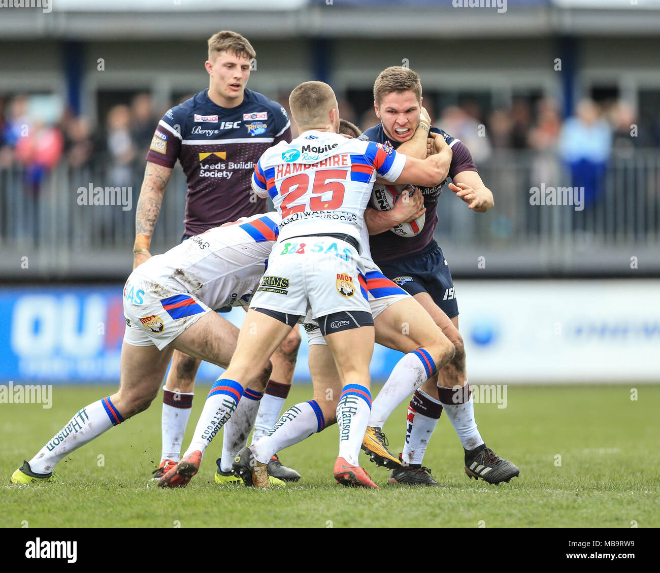 Wakefield, UK. 8th April 2018, Beaumont Legal Stadium, Wakefield, England; Betfred Super League rugby, Wakefield Trinity v Leeds Rhinos; Matt Parcell of Leeds Rhinos is tackled by Ryan Hampshire of Wakefield Trinity Credit: News Images/Alamy Live News Stock Photo