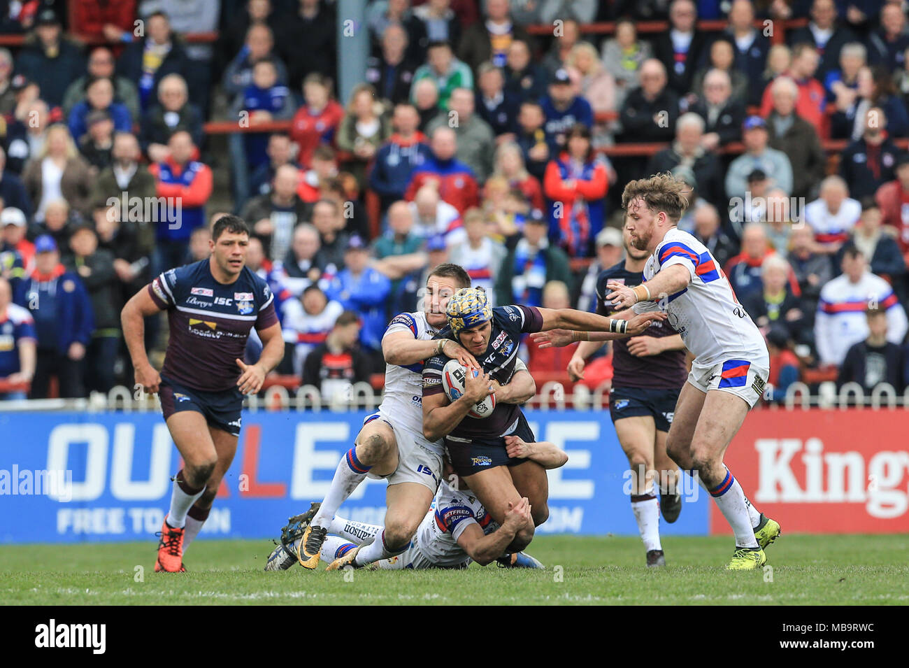 Wakefield, UK. 8th April 2018, Beaumont Legal Stadium, Wakefield, England; Betfred Super League rugby, Wakefield Trinity v Leeds Rhinos; Ashton Golding of Leeds Rhinos is tackled by Tyler Randell of Wakefield Trinity Credit: News Images/Alamy Live News Stock Photo