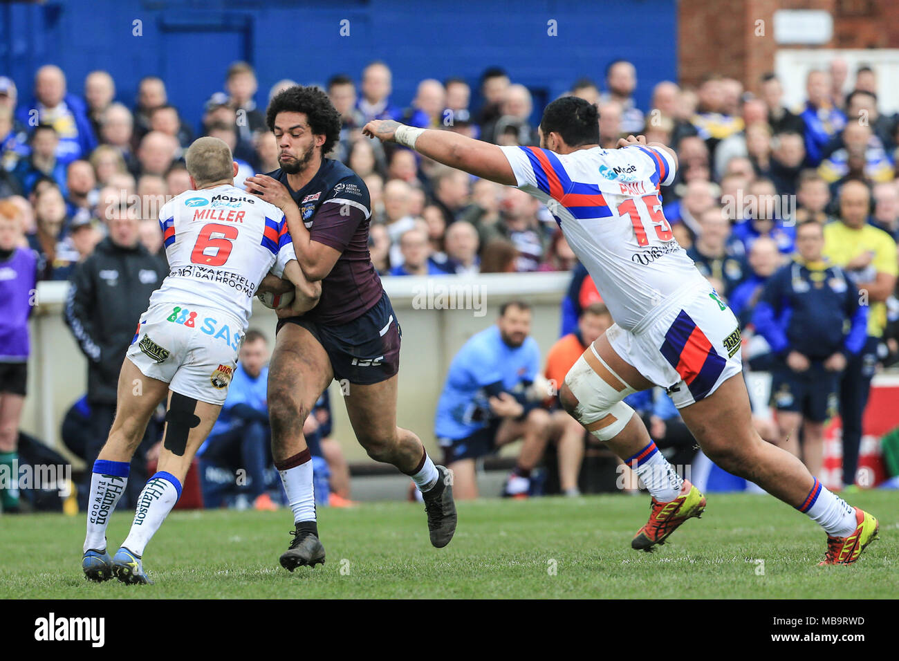 Wakefield, UK. 8th April 2018, Beaumont Legal Stadium, Wakefield, England; Betfred Super League rugby, Wakefield Trinity v Leeds Rhinos; Josh Walters of Leeds Rhinos is tackled by Jacob Miller of Wakefield Trinity Credit: News Images/Alamy Live News Stock Photo
