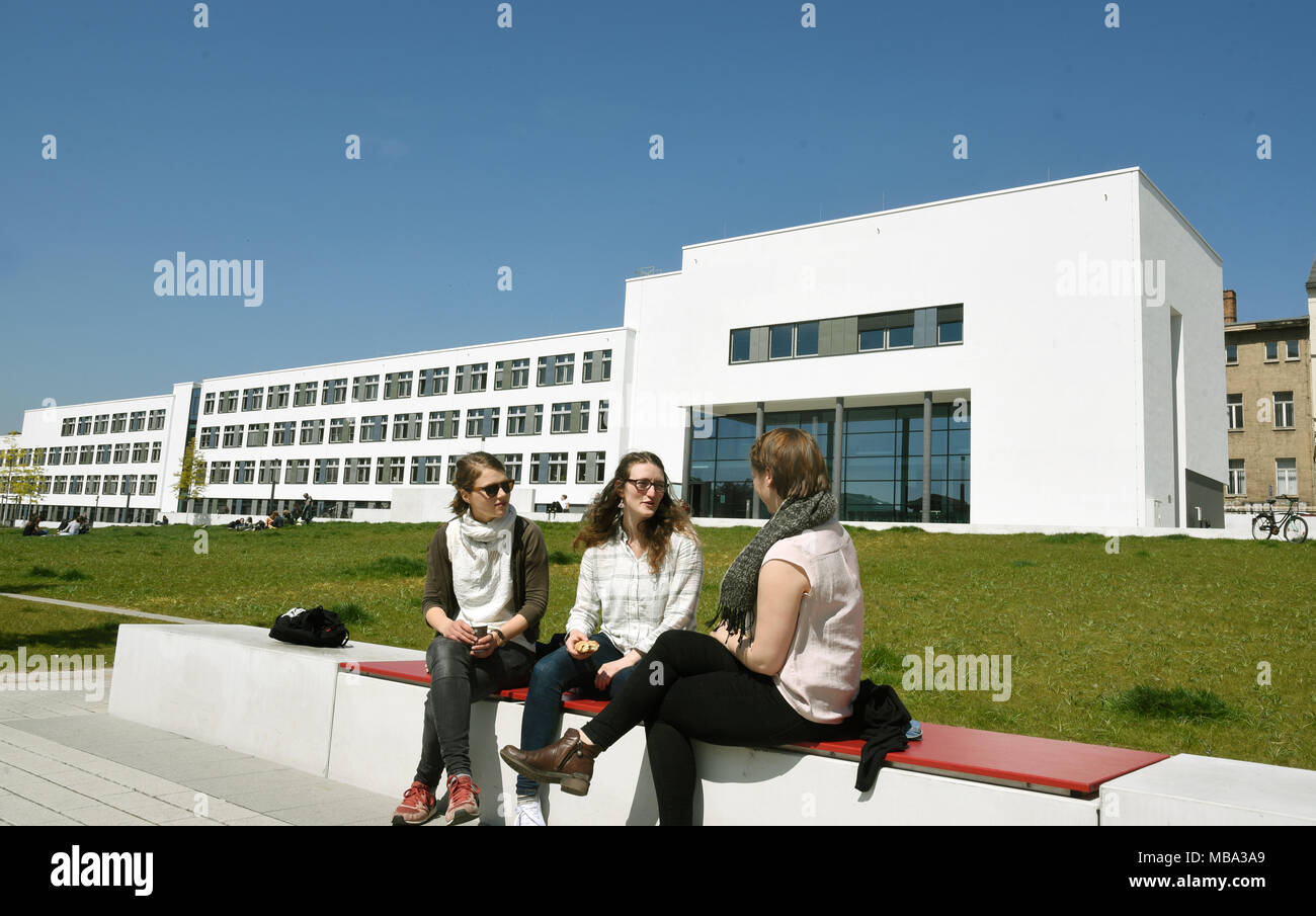 Students sitting outside at the Steintor Campus of Martin-Luther University  Halle-Wittenberg, Germany, on 12.05.2017. The Steintor-Campus in the city  centre of Halle/Saale was officially opened in October 2015. More than 52  million