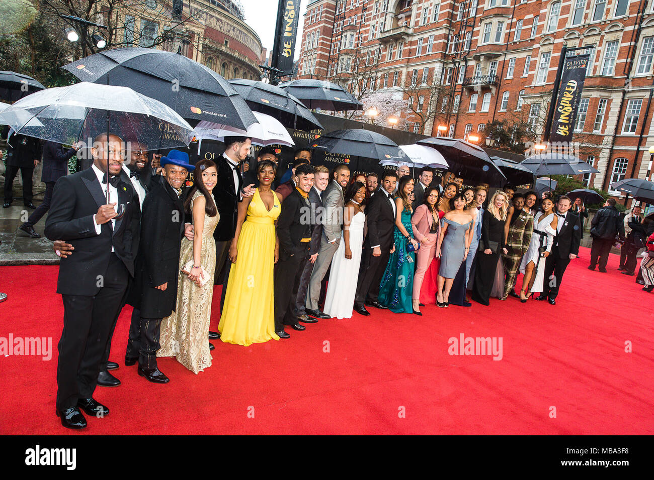 London, UK. 8th April, 2018. The cast of smash hit musical Hamilton pose in the rain on the red carpet at the 2018 Olivier Awards held at the Royal Albert Hall. Hamilton went on the win a record seven Oliviers including Best New Musical. Credit: David Betteridge/Alamy Live News Stock Photo