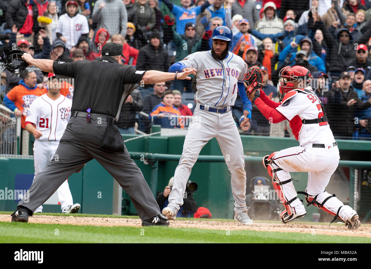 The Play. 7th Apr, 2018. Home plate umpire Marty Foster (60), left calls New York Mets shortstop Amed Rosario (1), center, safe after he scored on an Asdrubal Cabrera double in the seventh inning against the Washington Nationals at Nationals Park in Washington, DC on Saturday April 7, 2018. Washington Nationals catcher Pedro Severino (29), right, defends on the play. The Mets won the game 3-2. Credit: Ron Sachs/CNP (RESTRICTION: NO New York or New Jersey Newspapers or newspapers within a 75 mile radius of New York City) · NO WIRE SERVICE · Credit: dpa/Alamy Live News Stock Photo