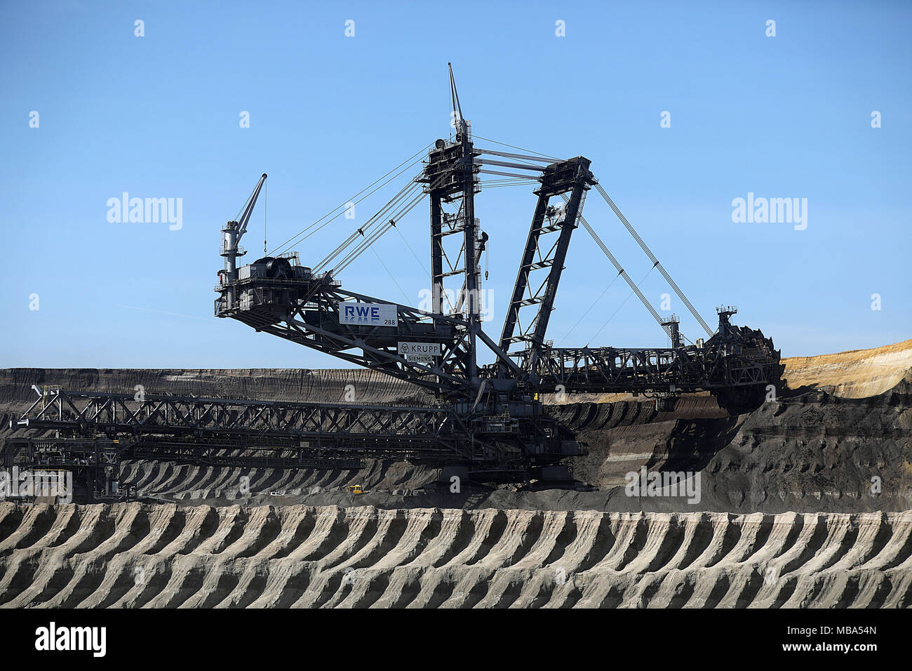 06 April 2018, Germany, Grevenbroich: A bucket wheel excavator mines brown coal at the surface mining Garzweiler in the Rhenish lignite mining region. Photo: Oliver Berg/dpa Stock Photo
