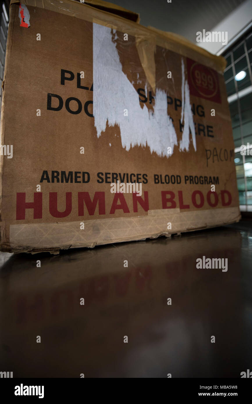 A Box Containing Donated Blood Sits In A Cart Awaiting Transport