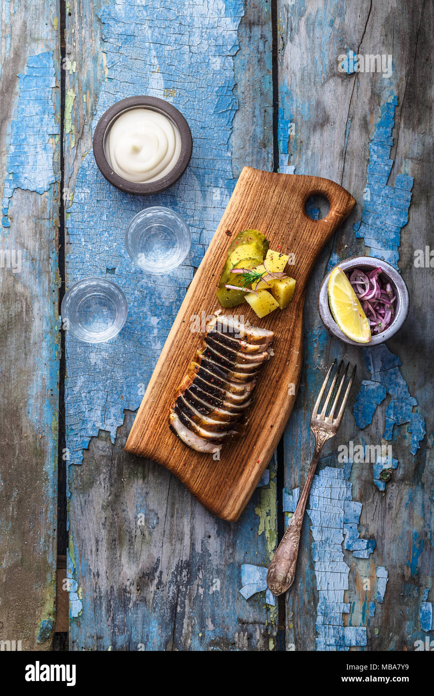 Pieces of smoked sturgeon on a cutting board Stock Photo Alamy