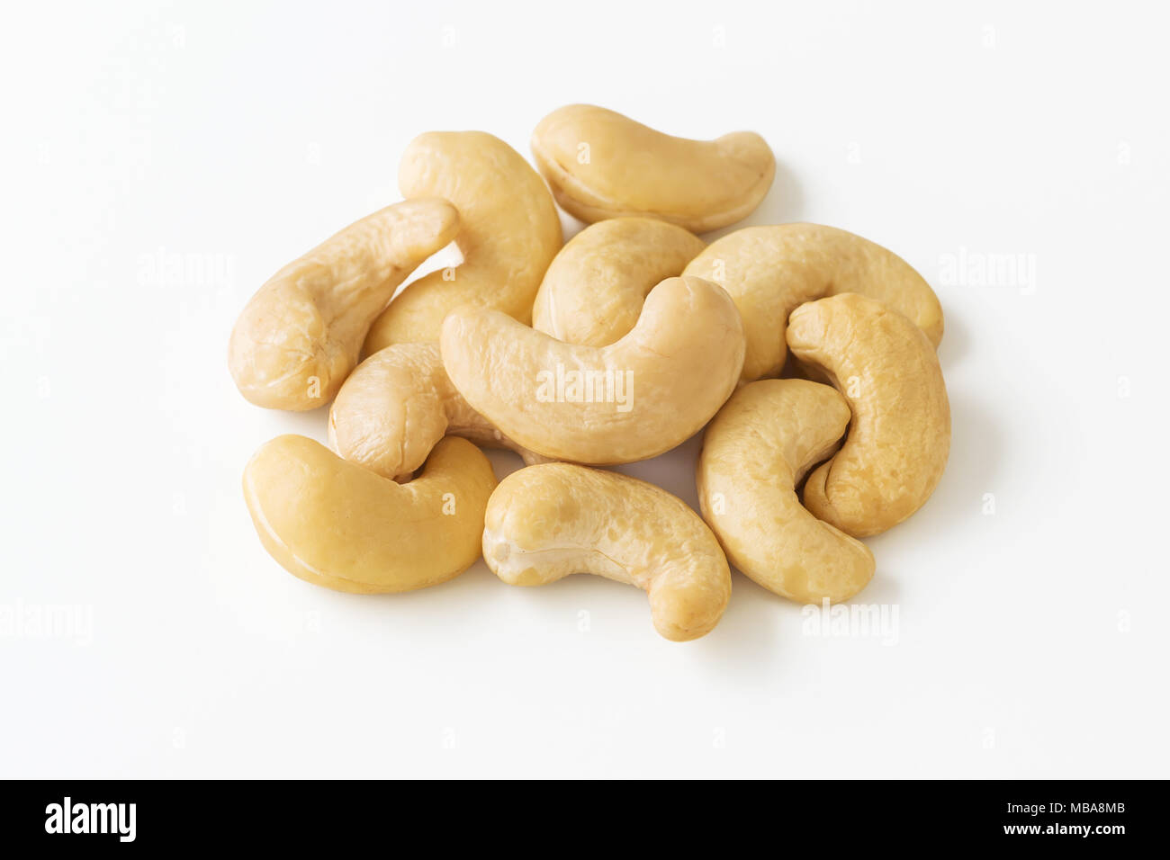 Raw cashew nuts closed up on white background Stock Photo