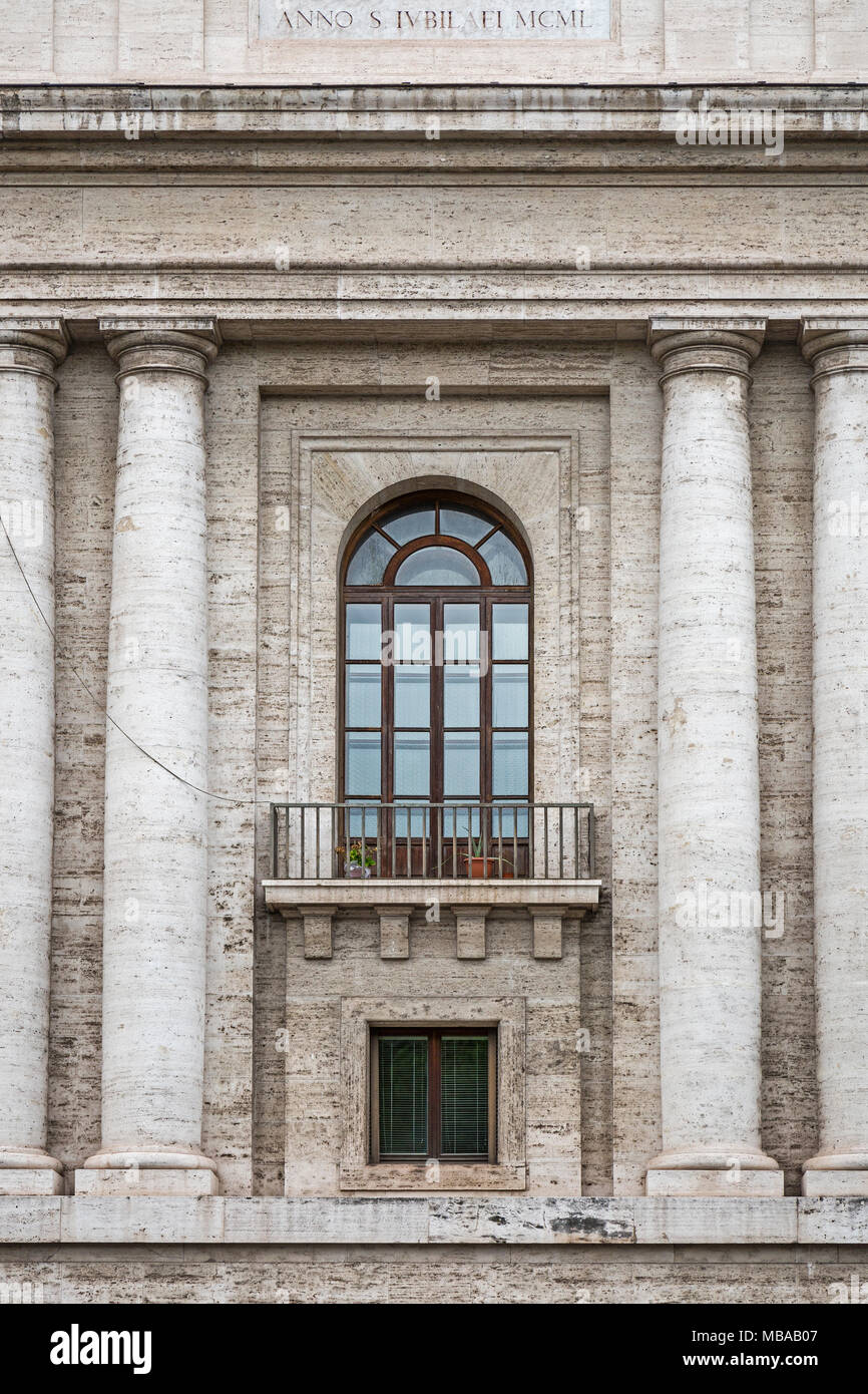 Balcony of a building on the corner of Piazza Pia and Via della Concillazione in Rome, Italy. The letters at the top show part of an inscription which Stock Photo