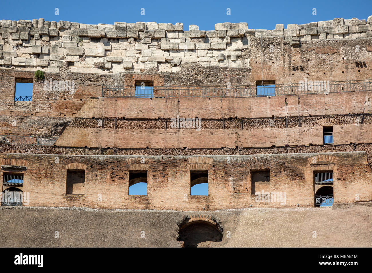 The upper walls of Colosseum or Coliseum, also known as the Flavian Amphitheatre or Colosseo, is an oval amphitheatre, the largest in the world, in th Stock Photo